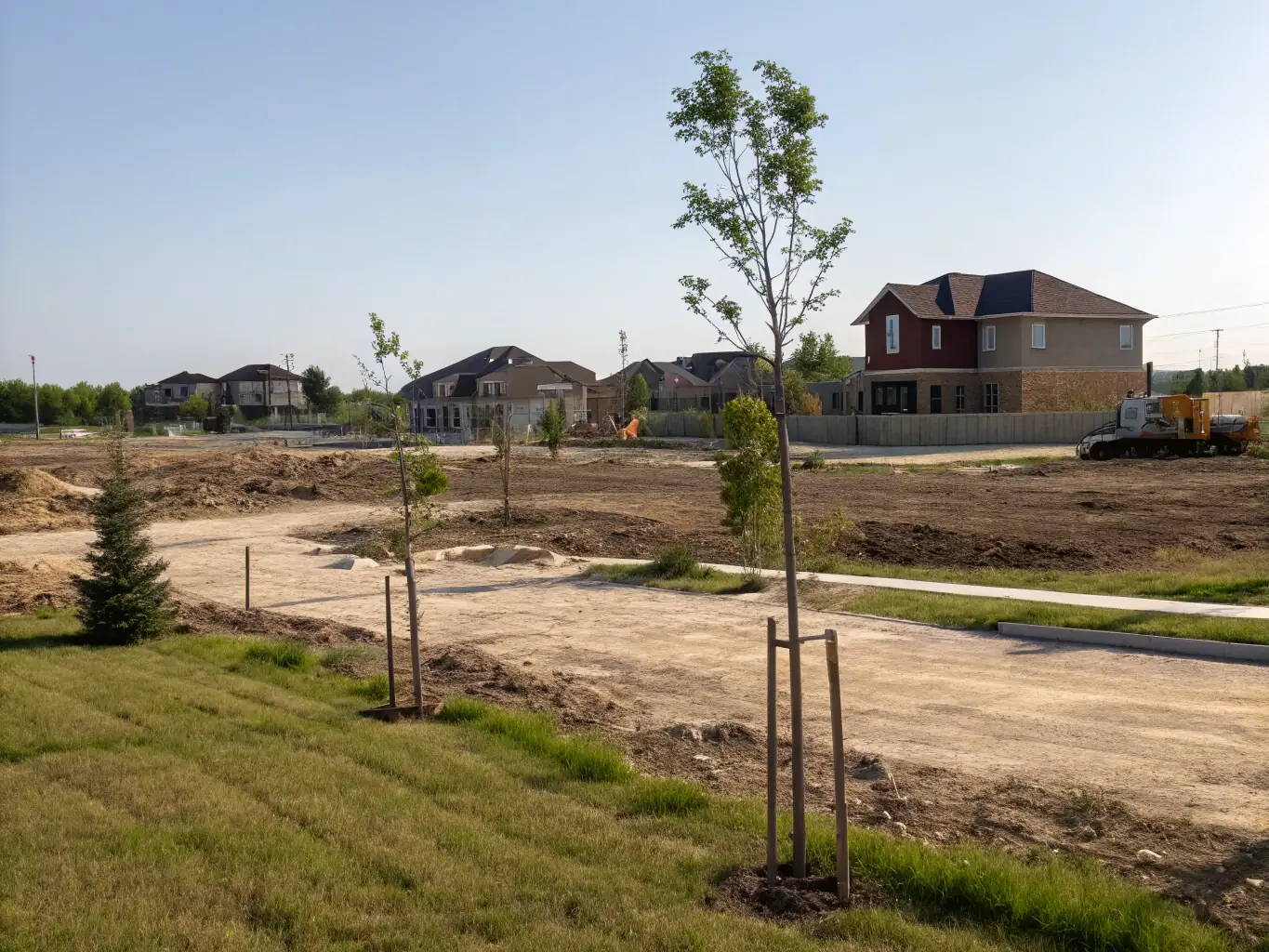 An aerial view of a residential lot in a suburban area, highlighting the potential for new construction and the surrounding community.